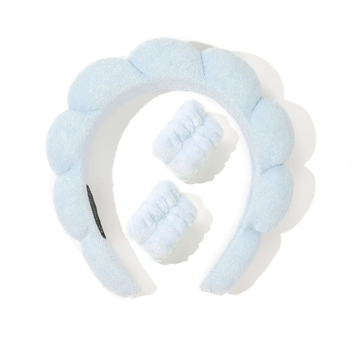 Light blue headband with white padding on a white background
