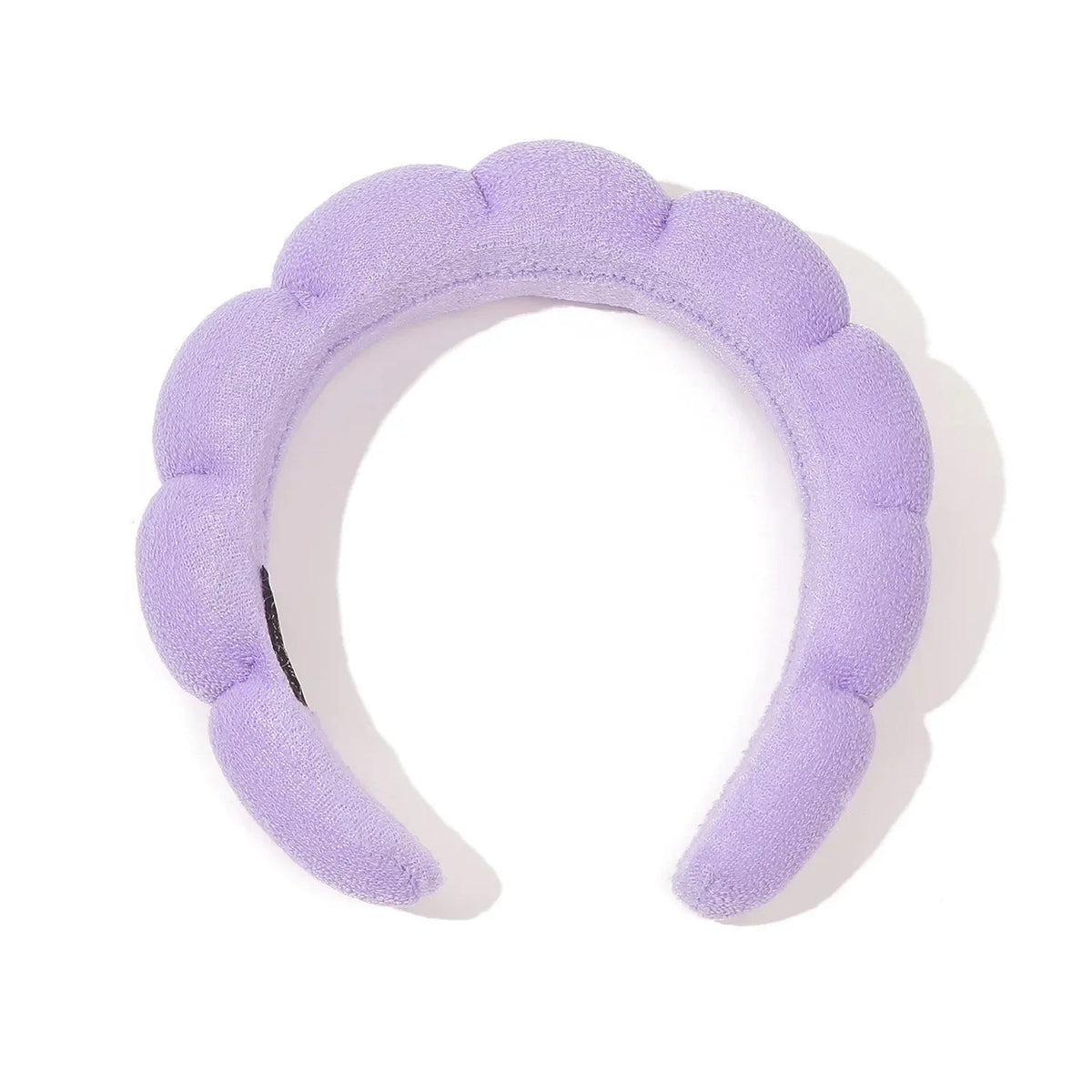 Purple headband with white interior on a white background